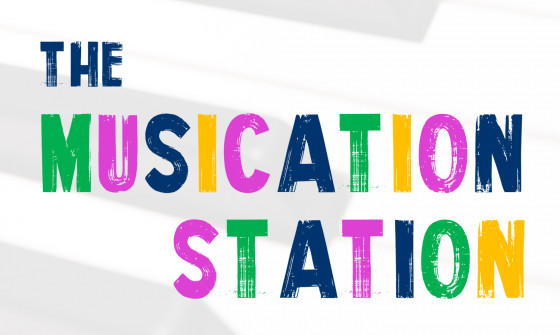The words 'The Musication Station' sits overlay on a piano in the background.