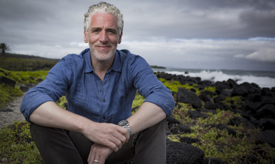 Gordon Buchanan sitting on a hill