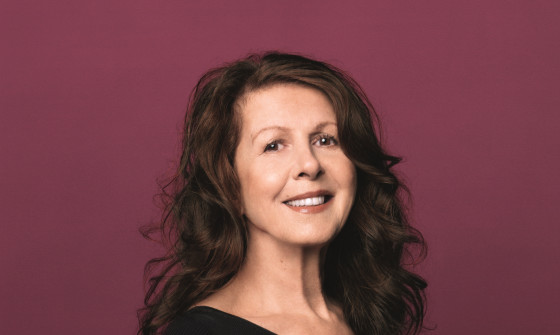 Elkie Brooks wears a black evening dress and smiles at the camera