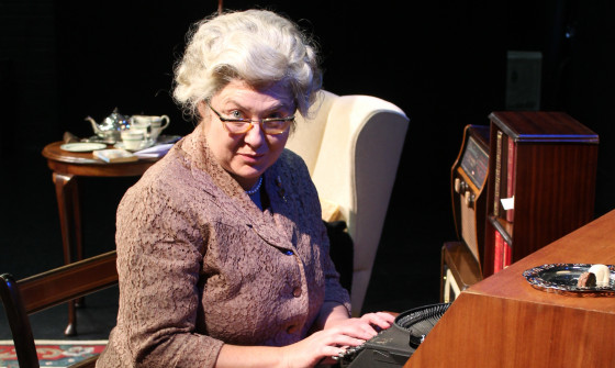 Mrs Christie sat at her desk typing